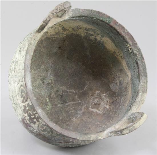 A Chinese archaic bronze tripod ritual food vessel, Ding, Western Zhou dynasty, 11th - 8th century BC, 22cm high, slight faults